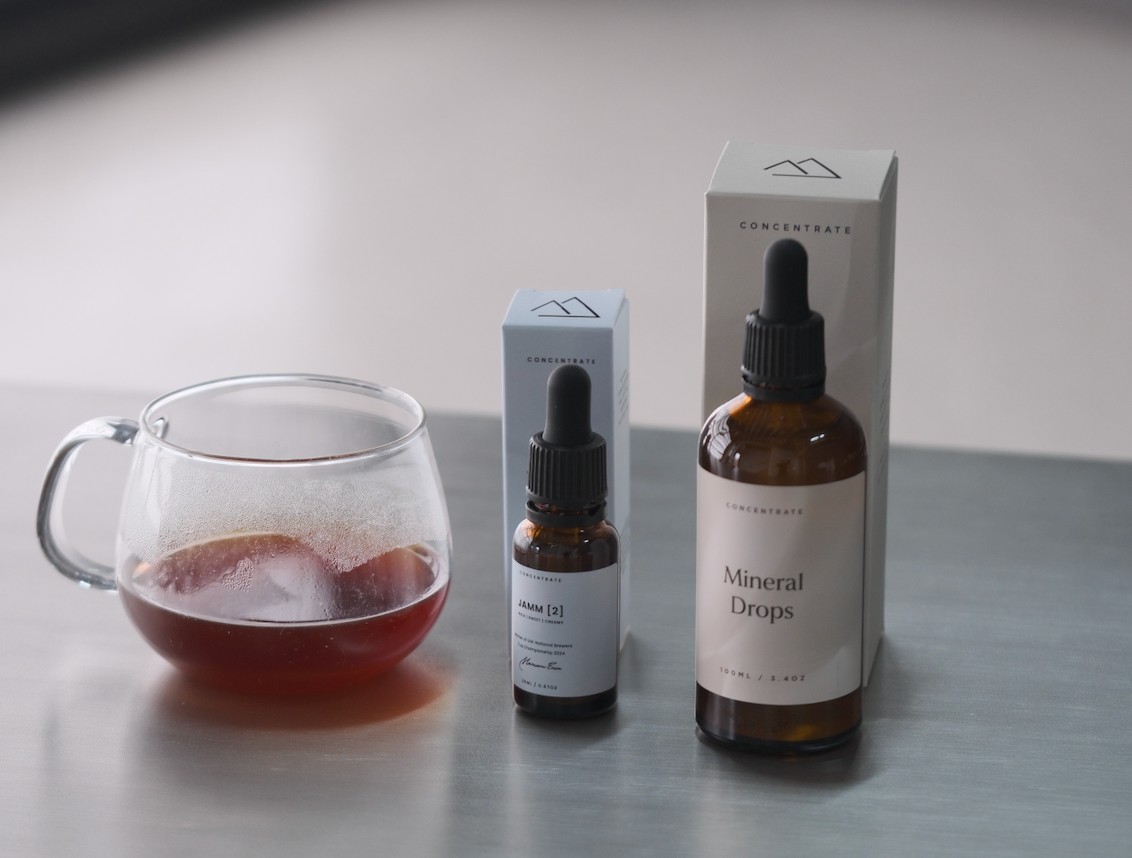 A Nano bottle of JAMM and a 100mL bottle of TONIK - mineral concentrates for coffee brewing
