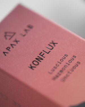 Close-up of a pink product packaging with 'Apax Lab' and 'Konflux' branding.