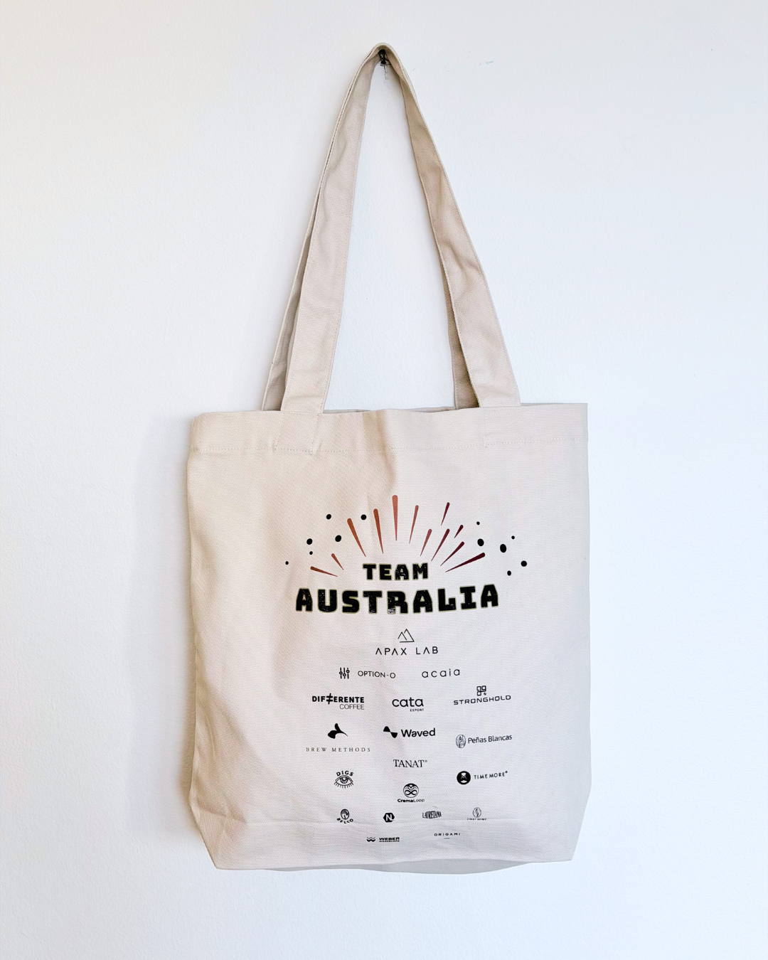 Bone colour tote bag with 'Team Australia' text and logos on a white background
